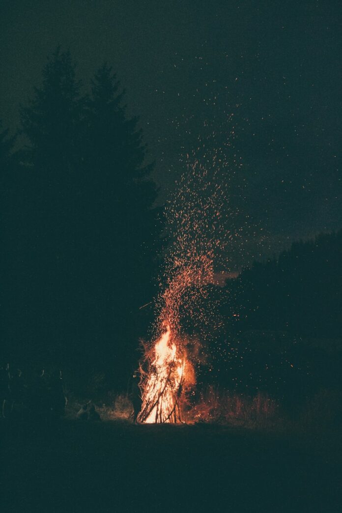 burning wood at night