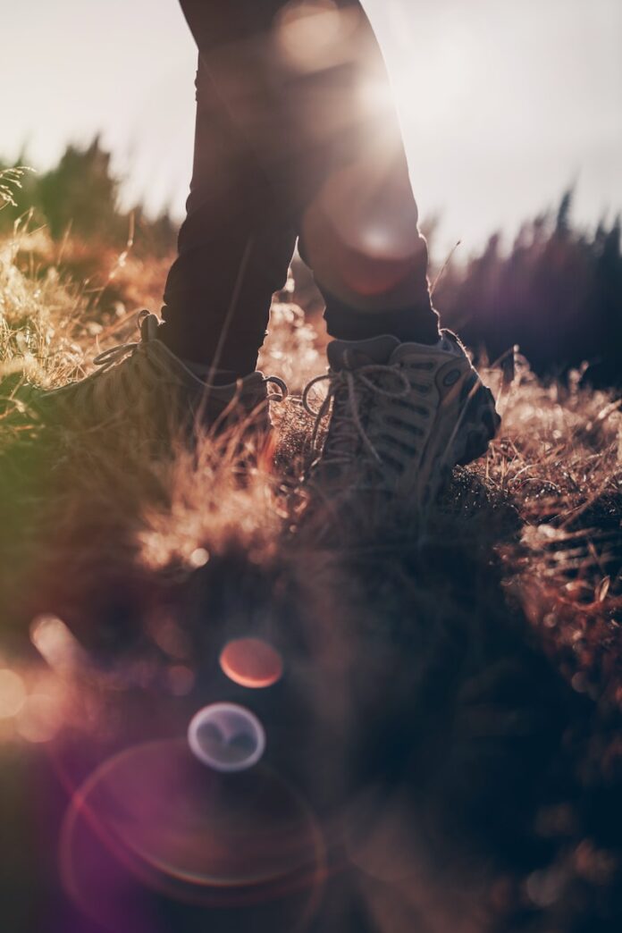 Photo by Clint McKoy person wearing white shoes