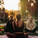 여성 건강, 일상 속 작은 변화에서 시작됩니다 a group of people sitting on top of a lush green field