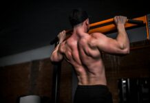 근육 건강, 일상 속 작은 실천이 만든다 topless man in black shorts holding orange bar
