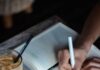 일상을 바꾸는 작은 습관, 정신건강 지키는 최신 라이프 트렌드 person writing on book