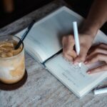 일상을 바꾸는 작은 습관, 정신건강 지키는 최신 라이프 트렌드 person writing on book